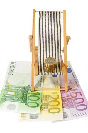 Model of canvas chair and euro coins and banknotesの写真素材