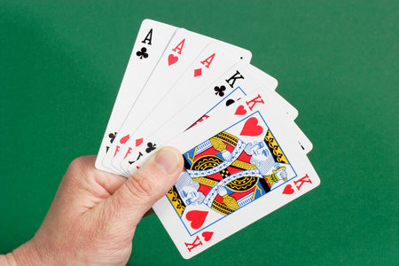Playing cards on green background. Shot in studio.