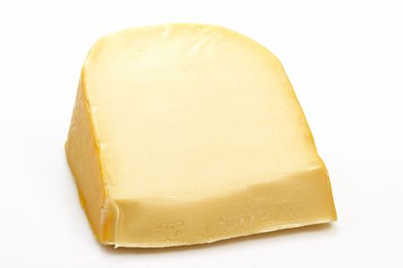 A big chunk of gouda cheese on bright backgroundの写真素材