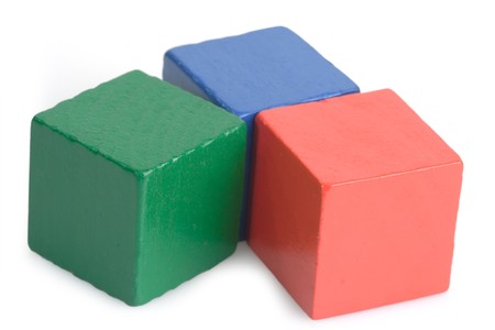 Wooden toy bricks isolated on white background