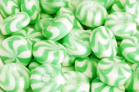 Green peppermint candy as background
