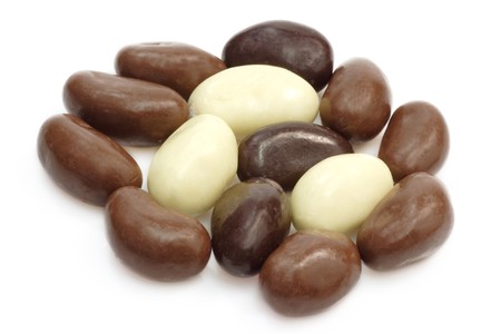 Small oval almond chocolates on bright backgroundの写真素材