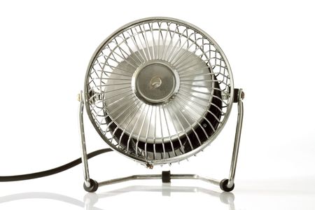 Electric silver fan  on bright backgroundの写真素材