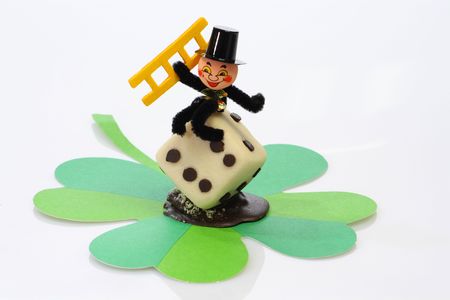 Lucky marzipan pig with cloverleaf and mushroom, on bright backgroundの写真素材