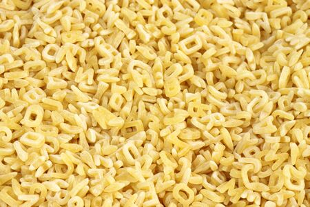 Yellow noodles close up as backgroundの写真素材