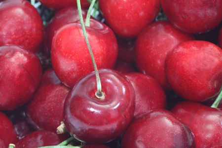 Close up from fresh cherry fruits as backgroundの写真素材