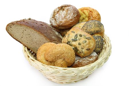 Bread basket with delicious bread rolls on white backgroundの写真素材