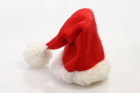 A Christmas Santa Claus hat on a white backgroundの写真素材
