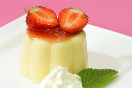 Delicious vanilla custard with fresh strawberries in detail-.の写真素材