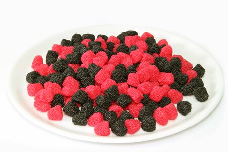 Raspberry and blackberry wine gums on bright backgroundの写真素材