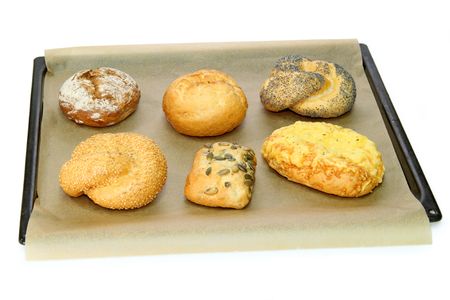 Fresh delicious bread rolls on white backgroundの写真素材