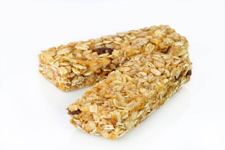 Two cereal bars on a bright backgroundの写真素材