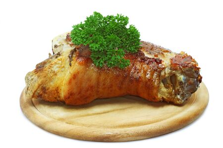 Smoked and roasted knuckle of pork on bright backgroundの写真素材