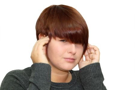 Young woman having a headache. Shot in studio.の写真素材