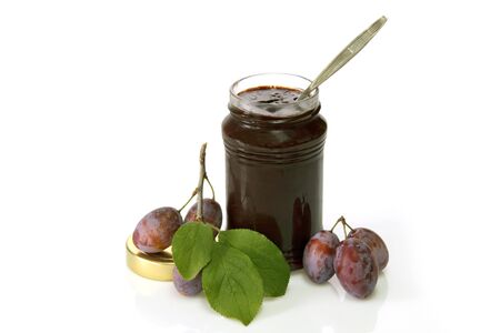 Fresh Plums and jam on a bright background.の写真素材