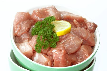 Fresh raw pieces of pork meat on bright backgroundの写真素材