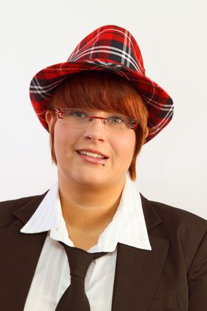 Beautiful young woman with hat on bright backgroundの写真素材