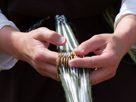 Detail from hands weaving. Shot outdoor.の写真素材