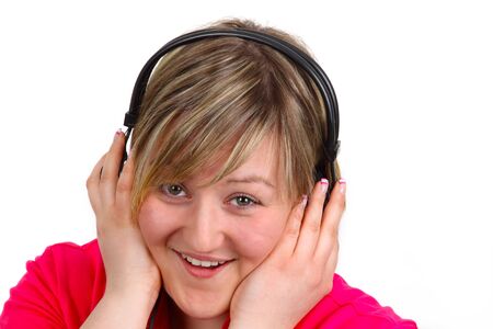 Young woman with headset on white background. Shot in studio.の写真素材
