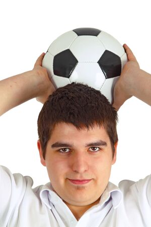 Junger Mann mit Fussball auf hellem Hintergrundの写真素材