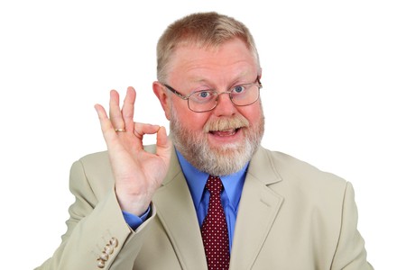 Senior businessman showing OK sign against a white background.
の写真素材