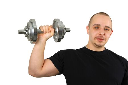 Young caucasian man with barbells isolated on white backgroundの写真素材