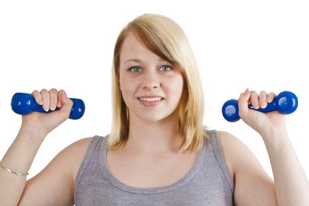 Young woman with dumbbell - isolated on white
の写真素材