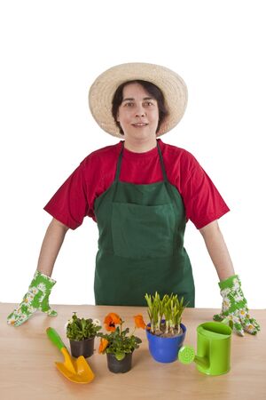 Woman gardener with garden tool isolated on white background.の写真素材