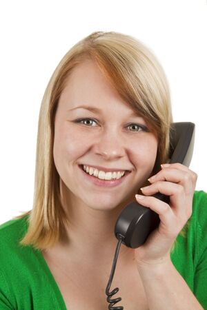 Young beautiful woman with phone isolated on whiteの写真素材