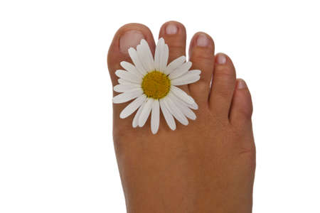 Foot with flower on white background.