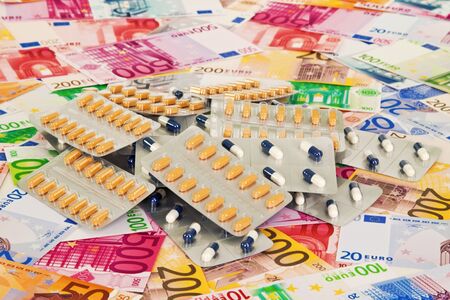 Pills on Euro banknotes as backgroundの写真素材
