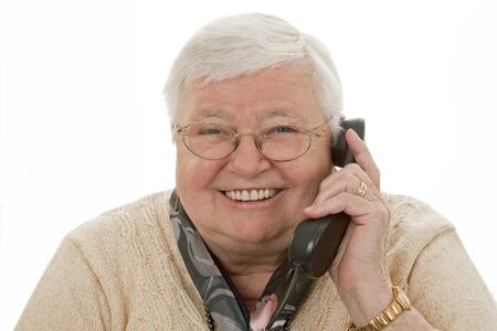 Senior female woman with telphone isolated on white backgroundの写真素材