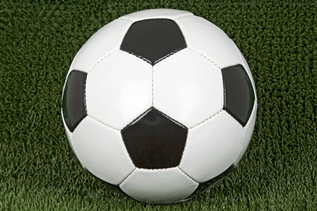 Soccer ball on green soccer meadow.の写真素材