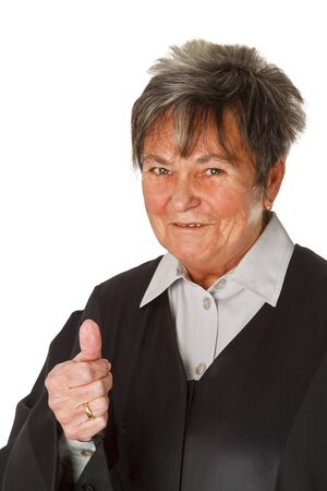 Female lawyer wearing a black robe isolated on white backgroundの写真素材