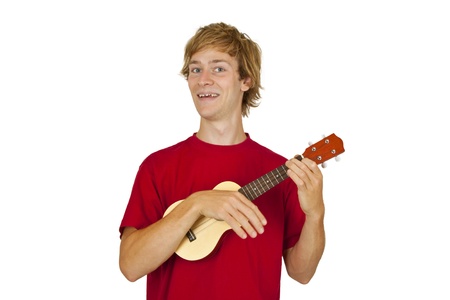 Young man with ukulele isolated on white backgroundの写真素材