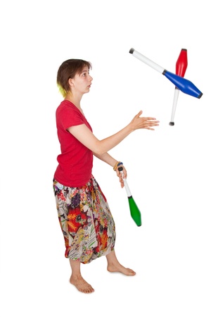 Young woman with juggling cubes isolated on white backgroundの写真素材
