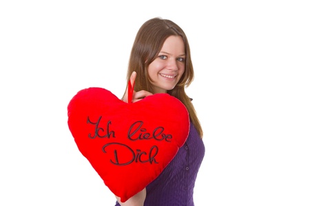Friendly young woman with velvet heart - isolated on white backgroundの写真素材