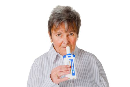 Female senior  with a Peak flow meter - isolated on white background
