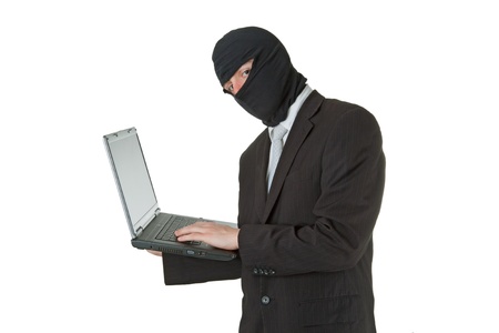 Man stealing data from a laptop isolated on white background