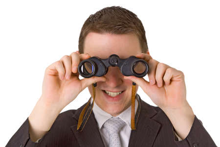 Young businessman with binoculars isolated on white backgroundの写真素材