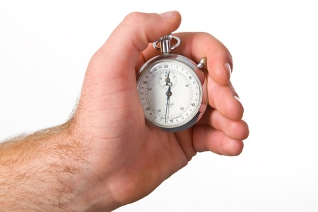 Human hand holding stop-watch - isolated on white backgroundの写真素材