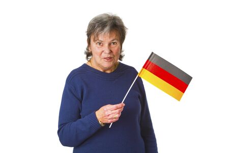 Female senior with german flag - isolated on white backgroundの写真素材