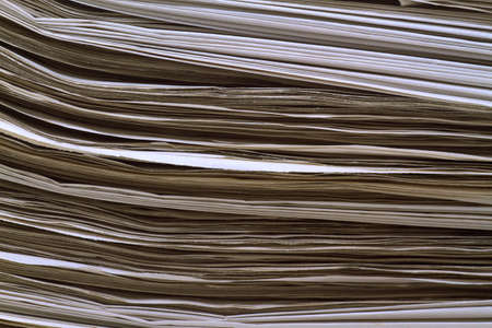 Image of a stack of newspaperの写真素材