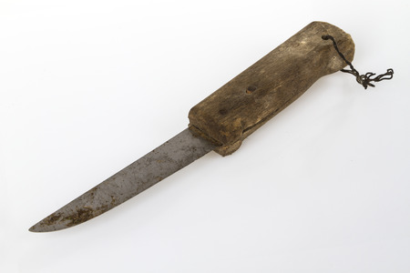 Old rusty knife on bright backgroundの写真素材