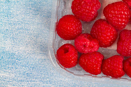 Fresh Raspberry on bright bue backgroundの写真素材