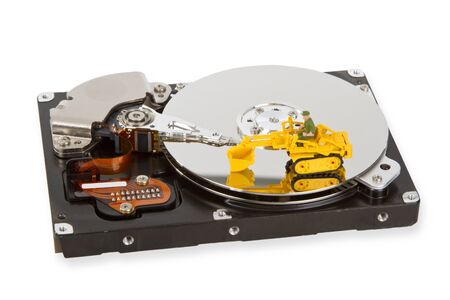 HDD with toy crawler mounted - data security concept.