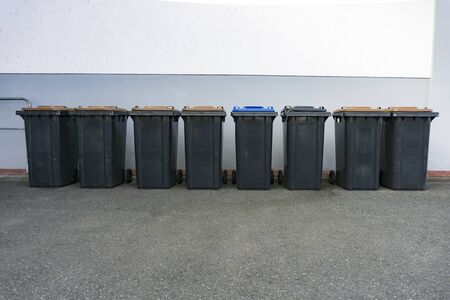 Lot of grey garbage can in a row