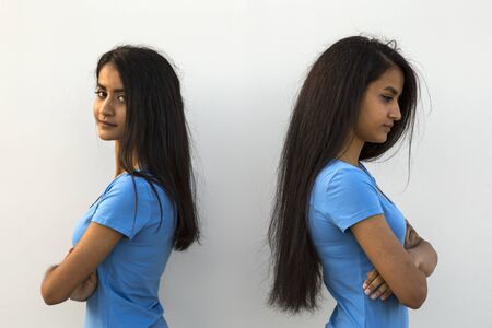 Beautiful offended young twins, outdoor shooting in summerの写真素材