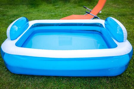 Paddling Pool in summer on green meadowの写真素材