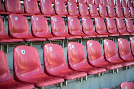 Detail from red chair series in a stadiumの写真素材